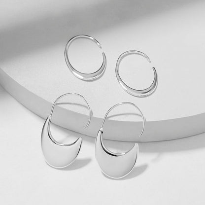 Both options of our silver curved hoop earring side by side