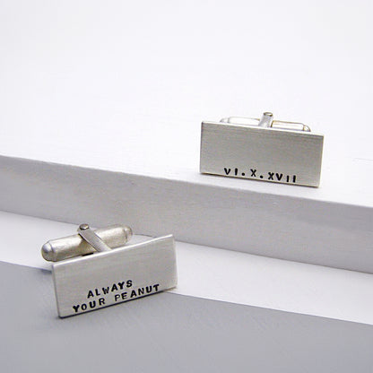 Personalised sterling silver cufflinks with hand-stamped text, brushed matt finish.