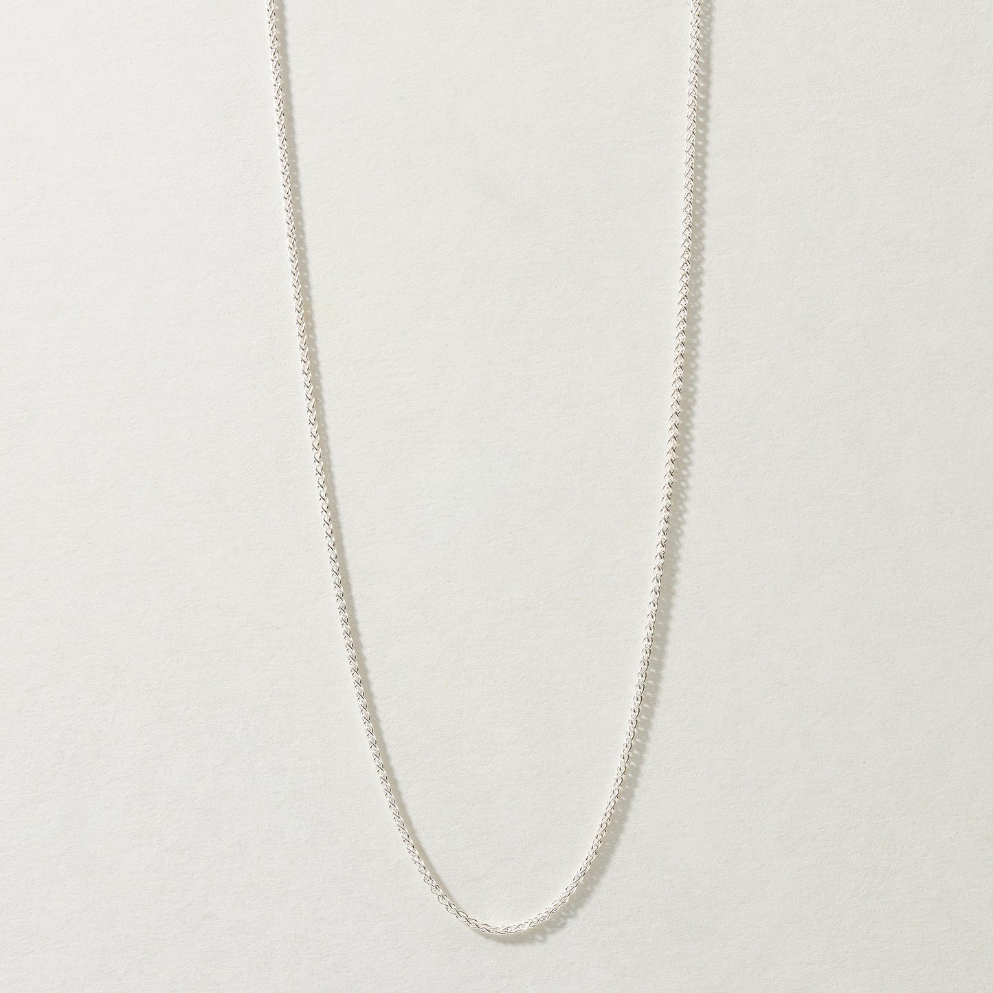 Full-length Spiga Chain Necklace in silver, available in 16, 18, and 20 inches.