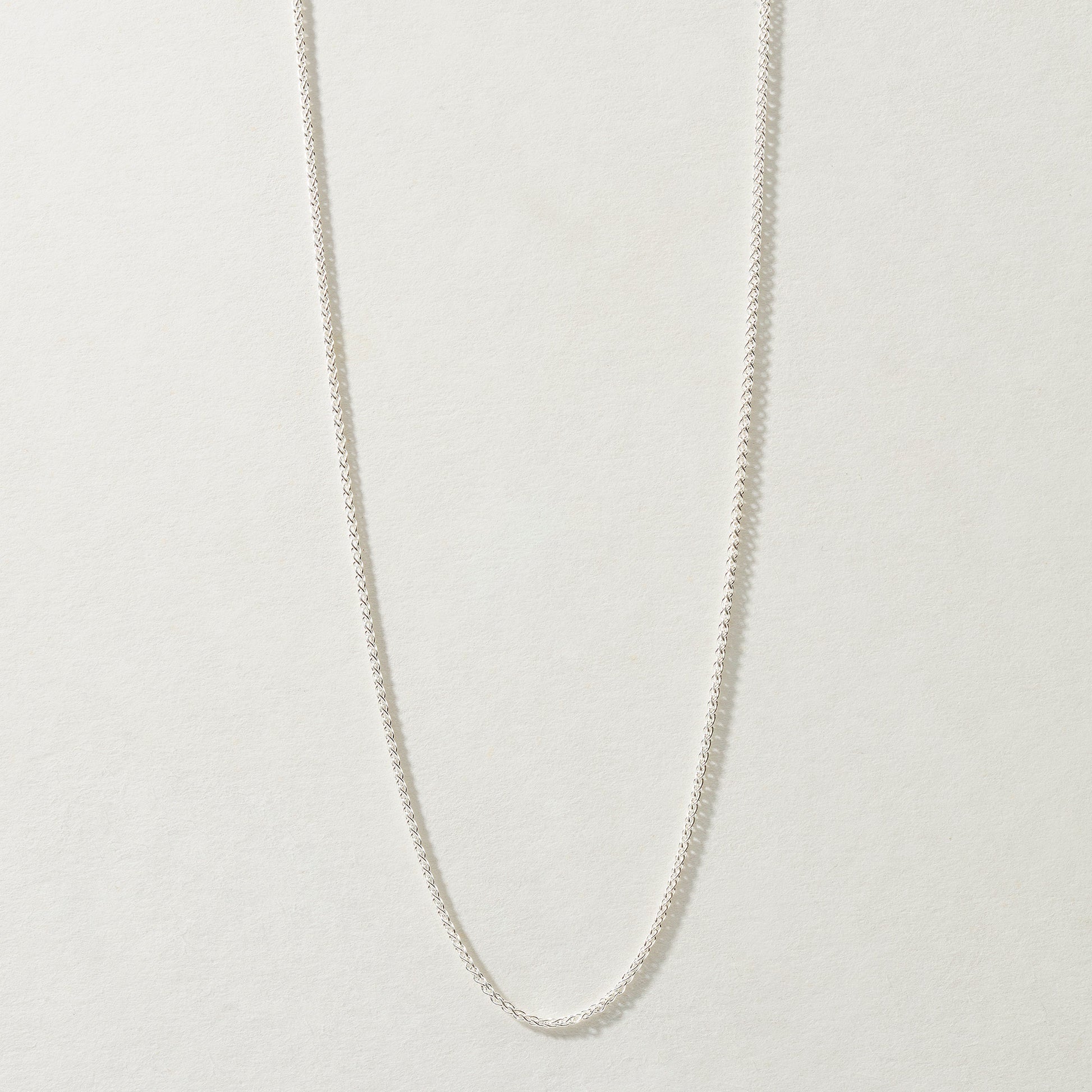 Full-length Spiga Chain Necklace in silver, available in 16, 18, and 20 inches.