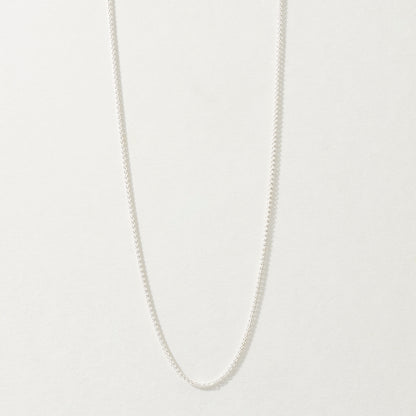 Sterling Silver Spiga Chain Necklace on neutral background.
