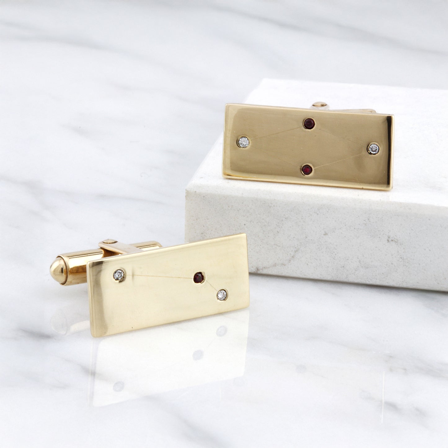 Gold Constellation Cufflinks with diamond and ruby detailing.