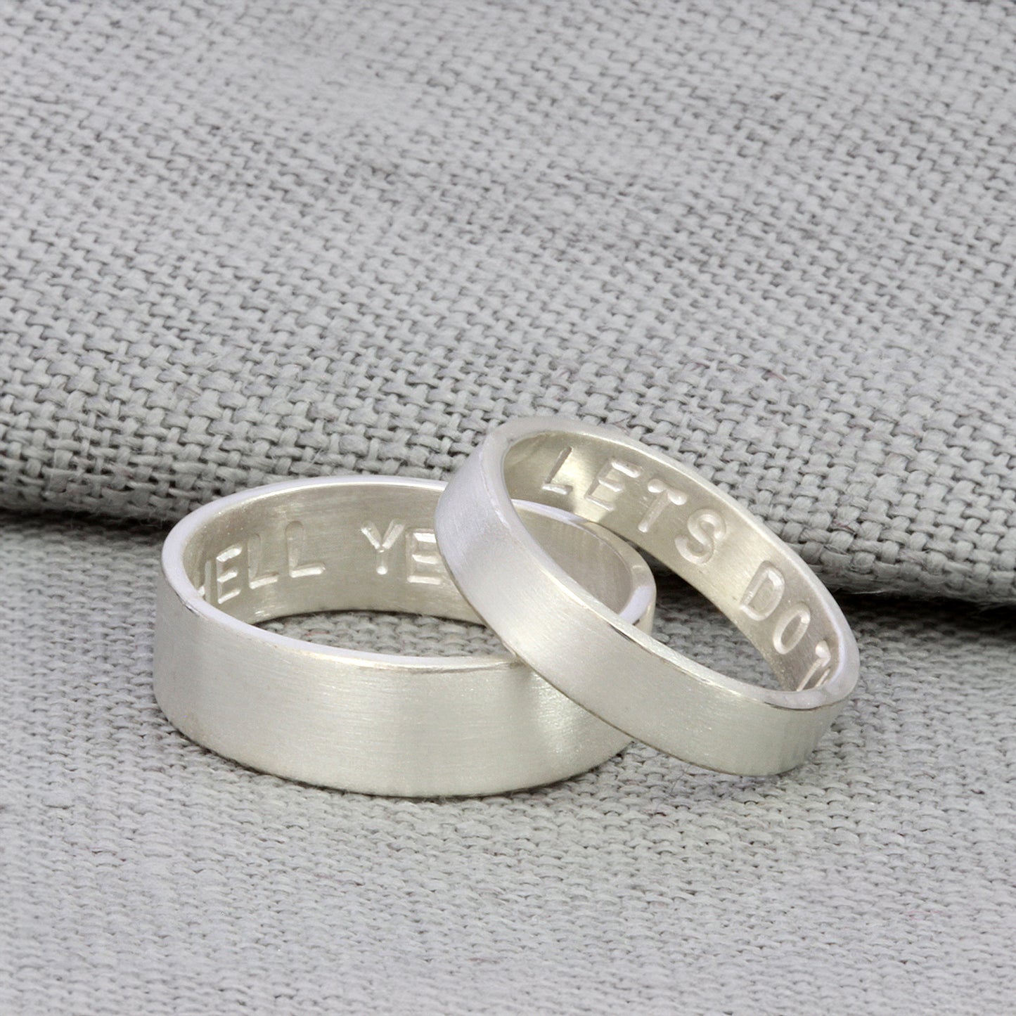 Sleek sterling silver matching rings with hidden personalisation