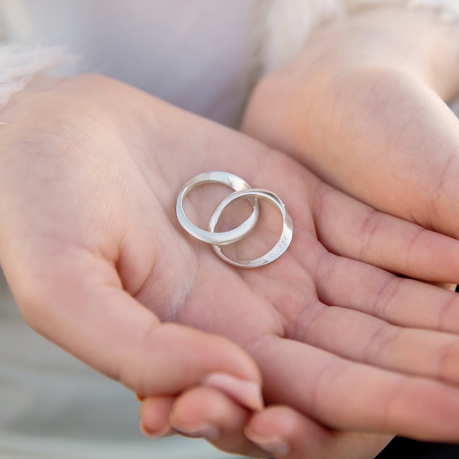 Sterling silver Mobius ring set, beautifully capturing the dual satin and polished finishes